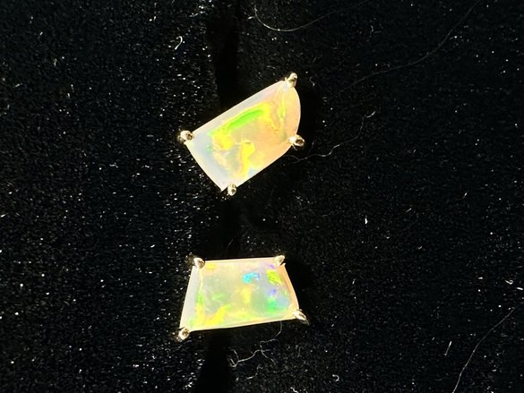 Bright opals in gold studs